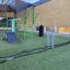 Battle Rope træningsudstyr placeret på græsplæne for udendørs fitness