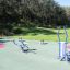 Udendørs fitnessudstyr Cross Trainer i parkmiljø.